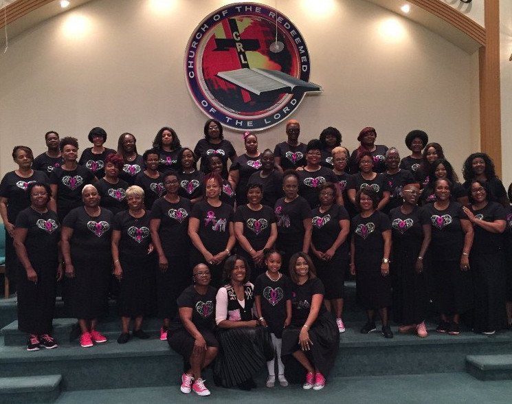 Church choir group posing on stage
